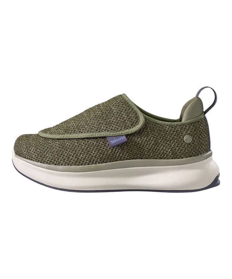 Side view of men's extra-wide adaptive footwear featuring easy-touch closures and a sleek black and gray mesh upper for superior ventilation