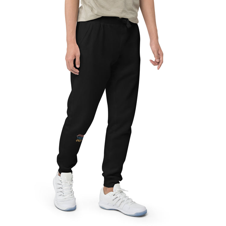 Close up of Black sweat pant featuring " Good vibes only" printed on right lower leg.