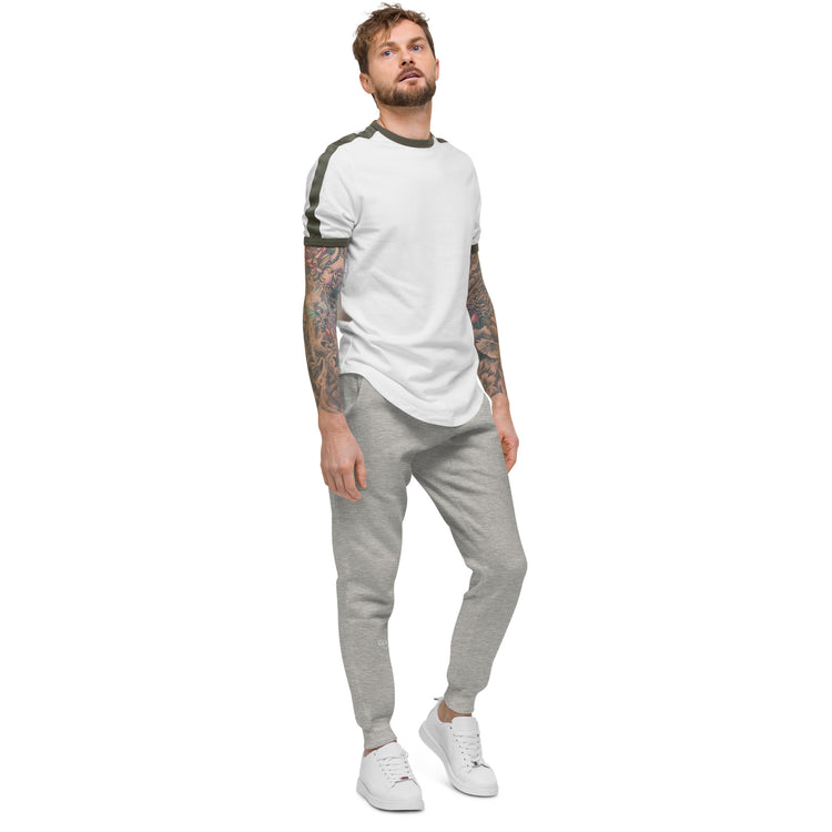 Side of full length Grey sweat pant, featuring "Good vibes" printed on right lower leg.