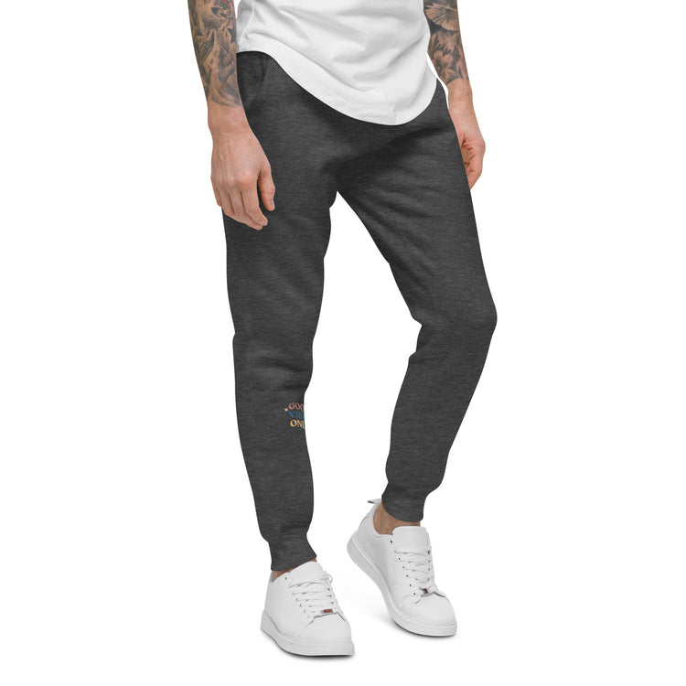 Side of charcoal sweat pant featuring " Good vibes only" printed on right lower leg.