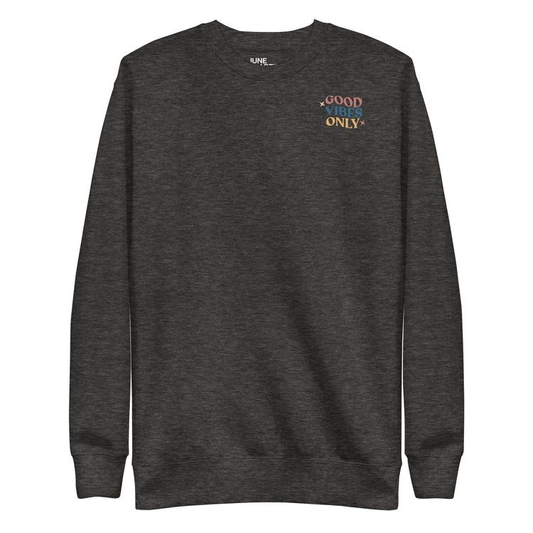 Charcoal crew neck sweatshirt spreading "Good vibes Only" energy.