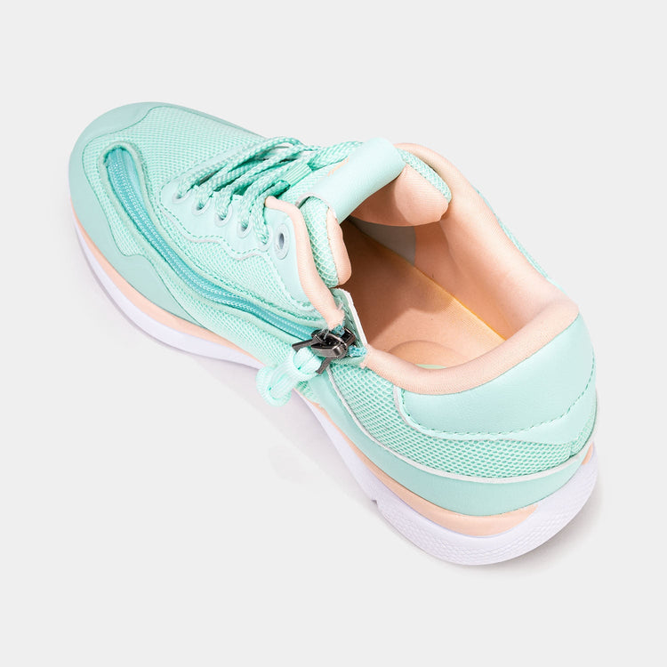 Mint women's shoe with white bottom, peach accents, and rear zipper access.