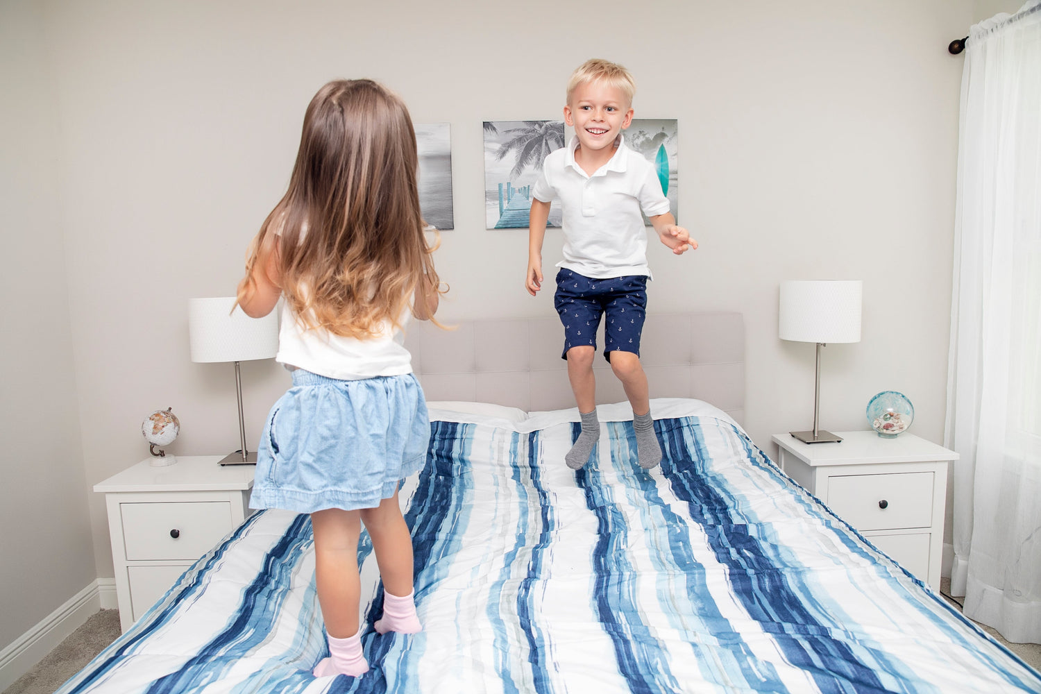 Children playing wearing anti slip socks with tread pattern on the bottom.