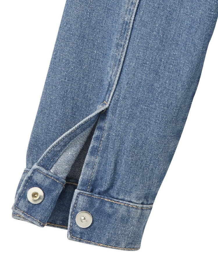 Bottom of denim jacket sleeve with magnetic silver button on cuffs