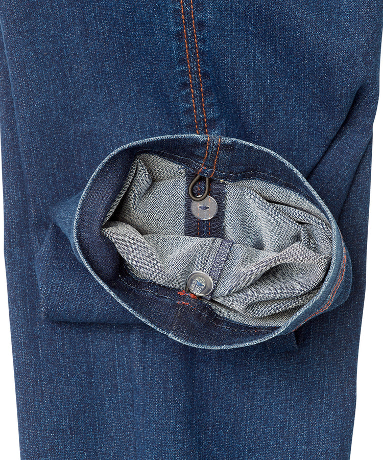 Close up of ankle of women’s indigo blue cargo jeans with pull up loops.