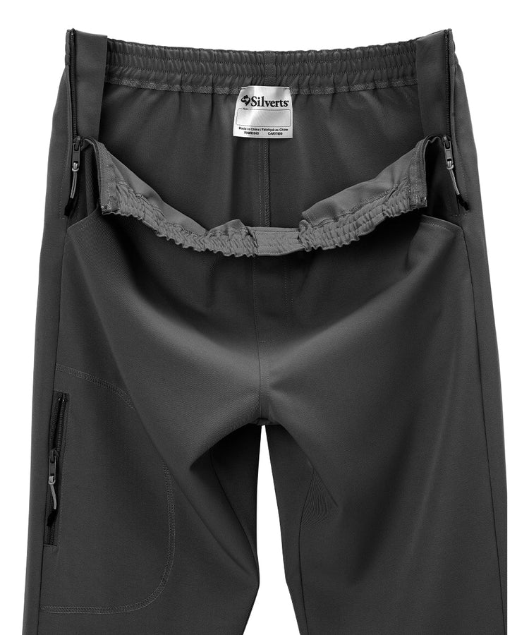 Close up of women’s black side zipper pants with pull up loops and elastic waist.