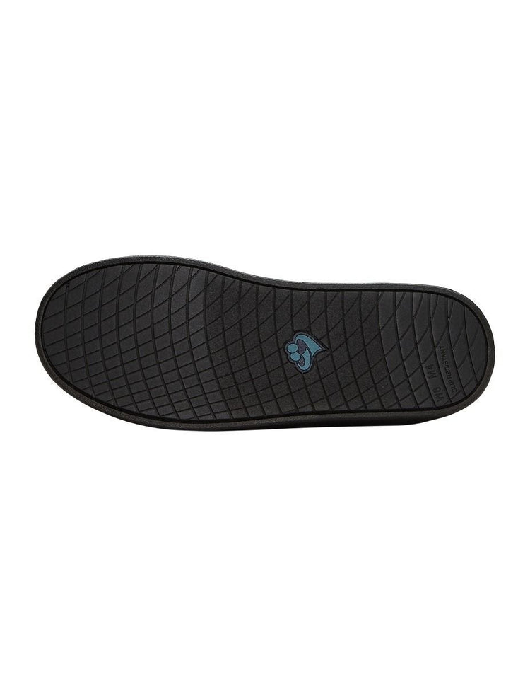 Heel of women’s black non slip slippers with large velcro closure.