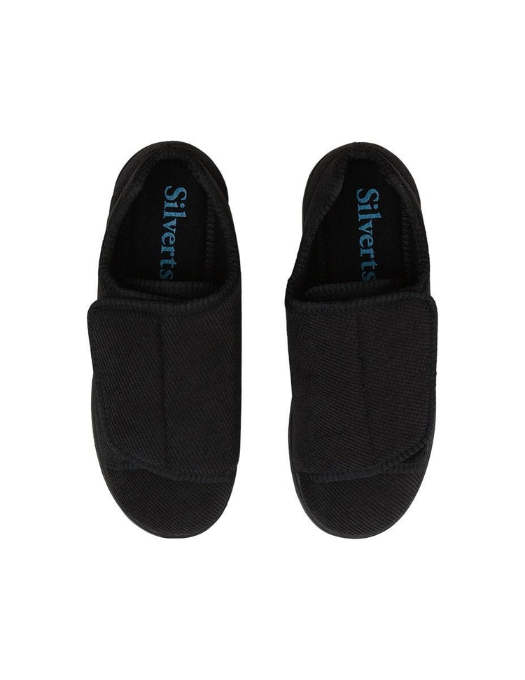 Women’s black wide non slip slippers with large velcro closure for an adjustable fit.