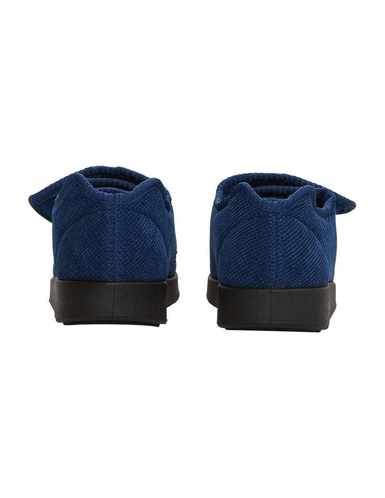 Heel of women’s navy blue non slip slippers with large velcro closure.