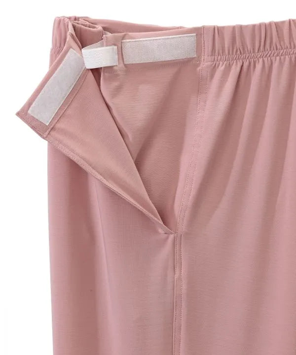Women’s Dusty Pink pants with side closure, adjustable straps, and loop fasteners on waistband. side closure