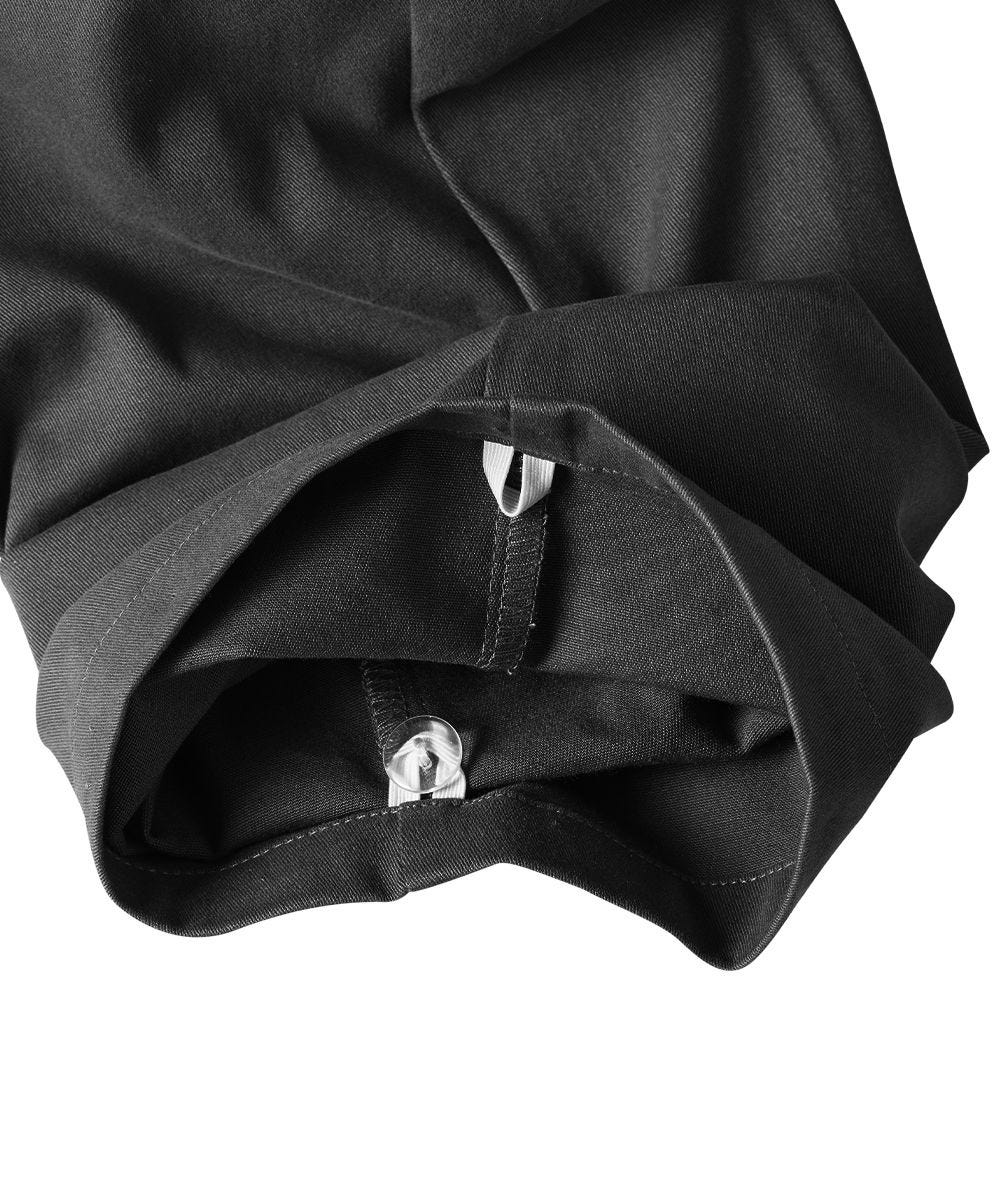 Bottom of black pants feature inner grip loops to adjust hem of pants