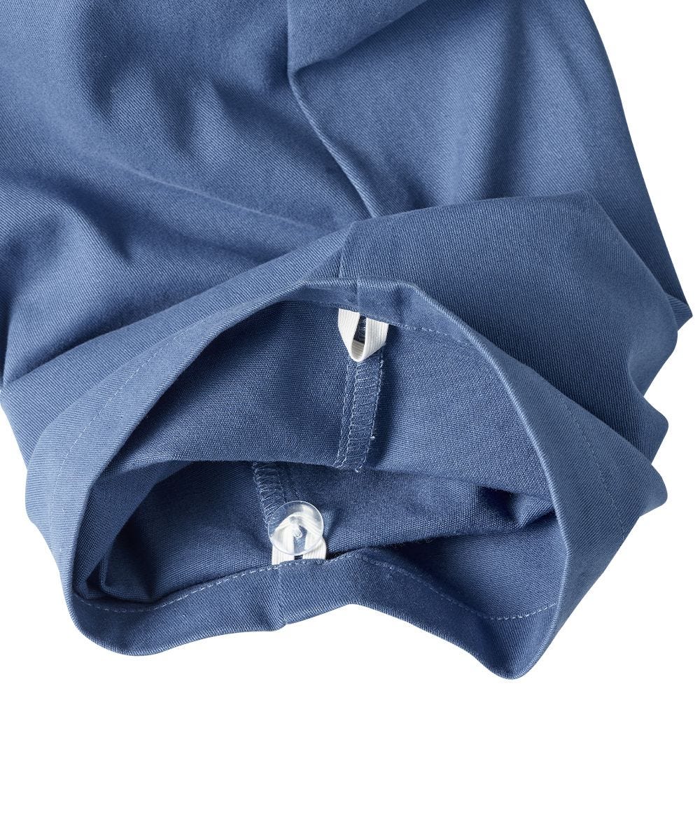 Bottom of blue pants feature inner grip loops to adjust hem of pants
