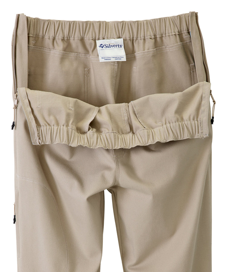 Khaki dressing pants with the zippers on side wide open showing the easy accessibility