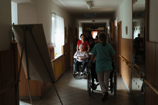 Nurses pushing patients through halls