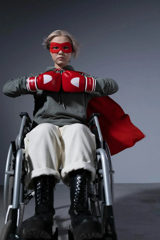 Girl in costume sitting in wheelchair