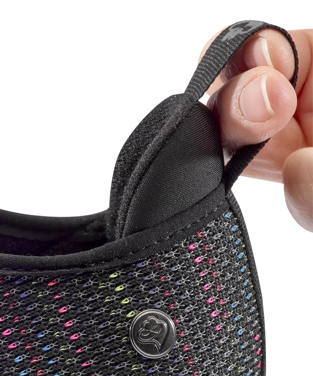 Close-up of the back pull tab on June Adaptive Women's Extra Wide Comfort Adjustable Shoes in Black Speckle, demonstrating easy handling and wear.