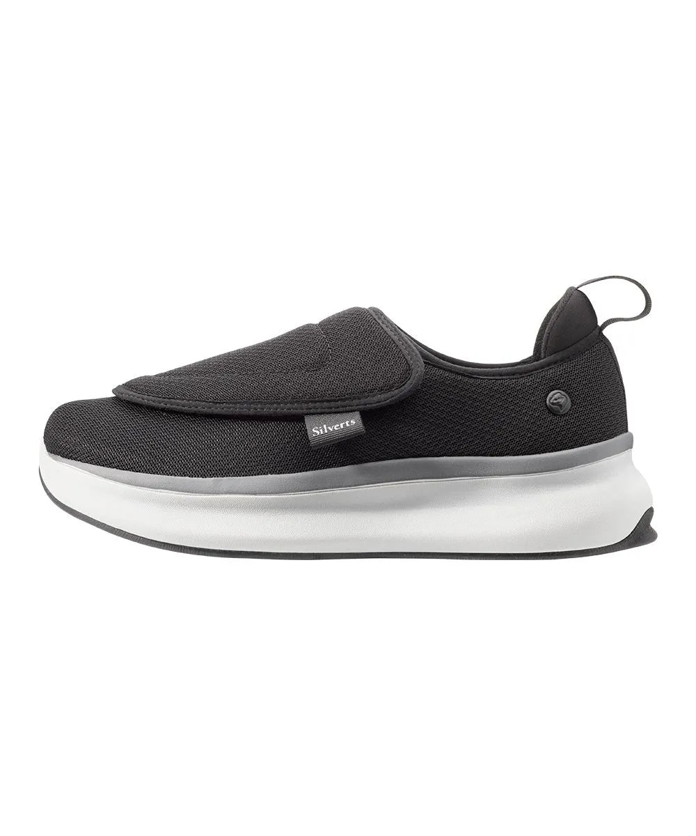 Side view of men's extra-wide adaptive footwear featuring easy-touch closures and a sleek black and gray mesh upper for superior ventilation