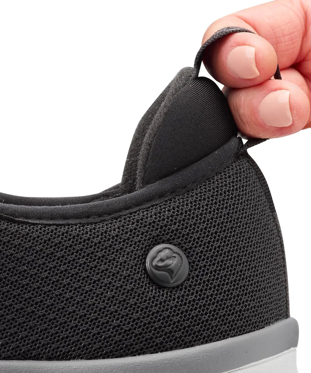 heel pull tab on men's extra-wide adaptive shoes, facilitating easy wearing with a comfortable, cushioned heel design