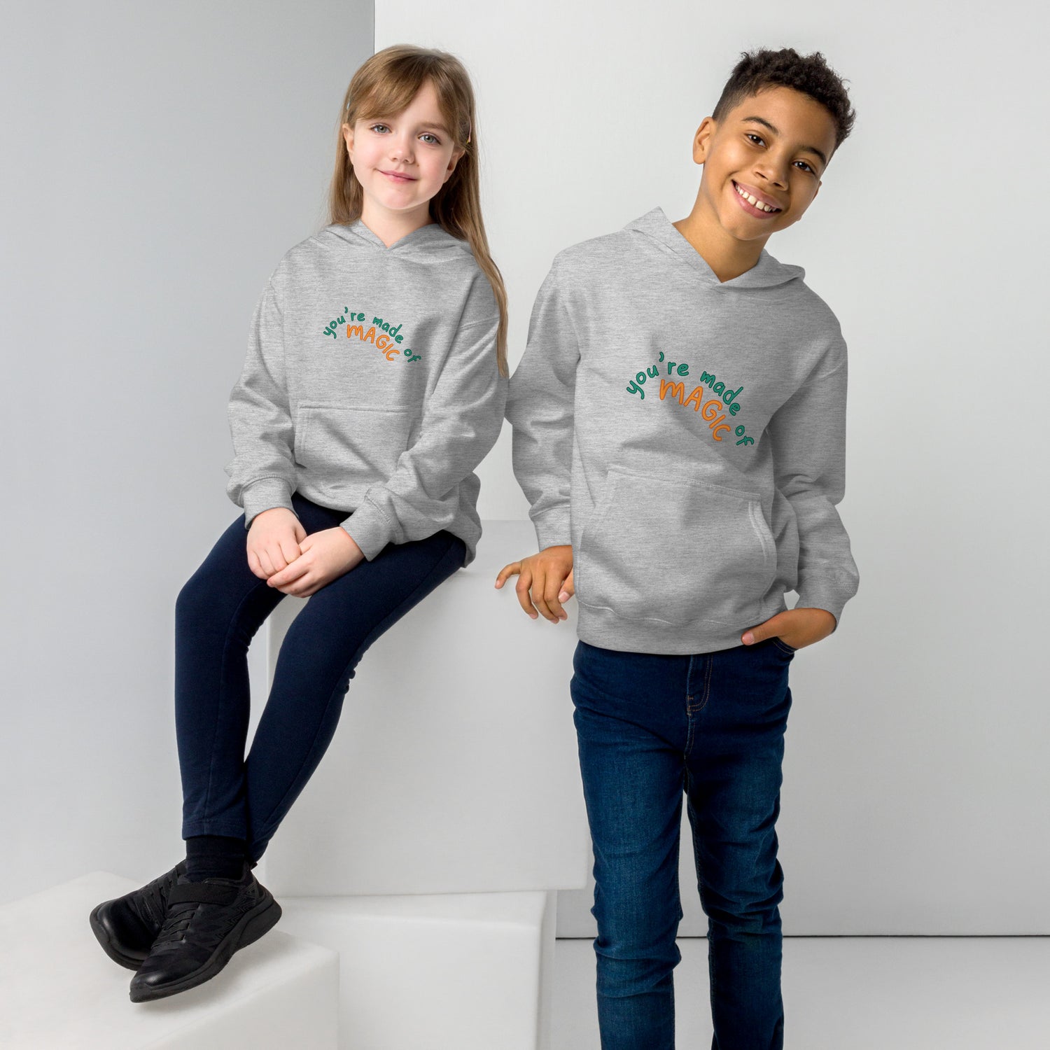 Grey Kidswear hoodie featuring a " you're made of Magic" design with pockets at front.
