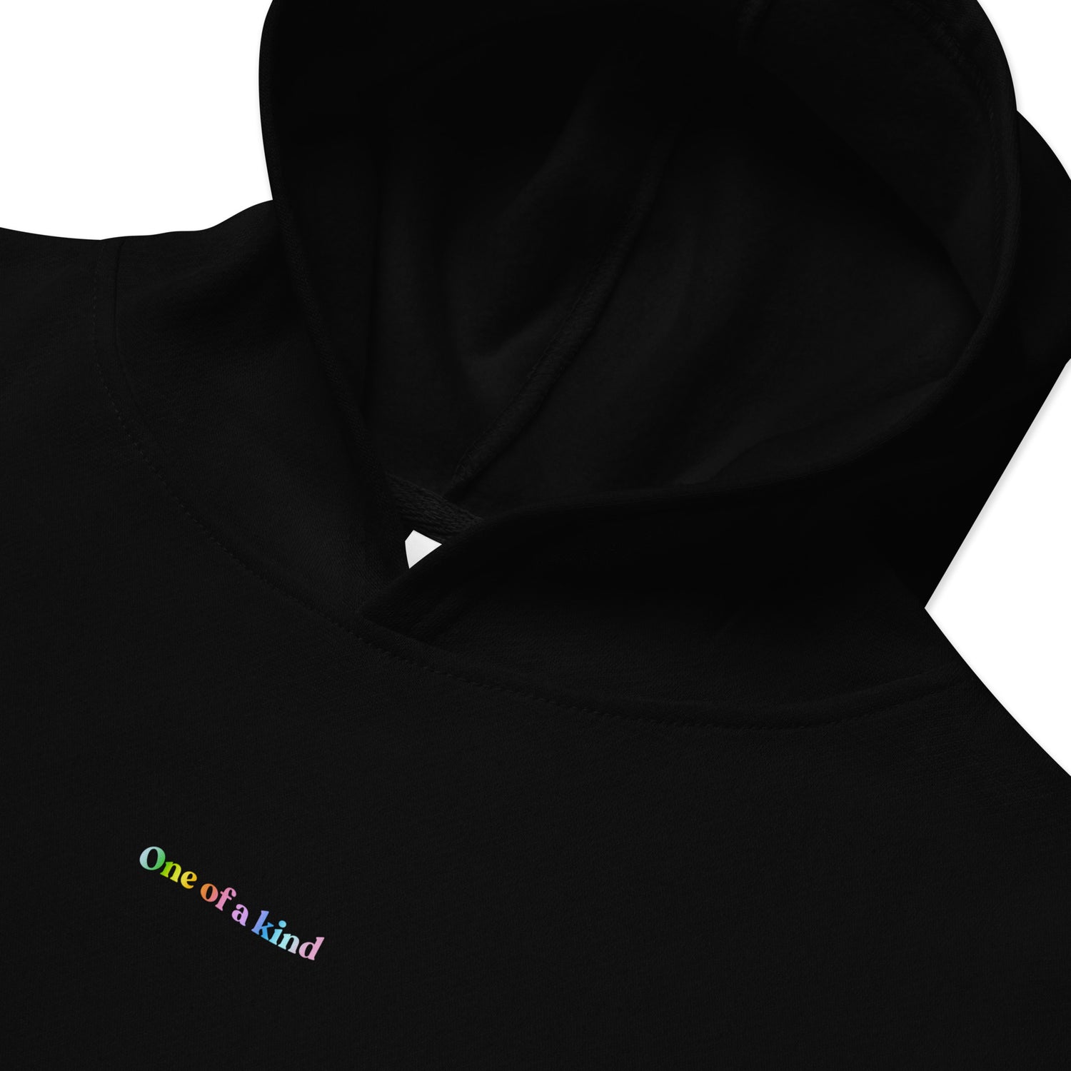 Closeup of Black Kidswear Hoodie featuring "One of a kind" printed on front.
