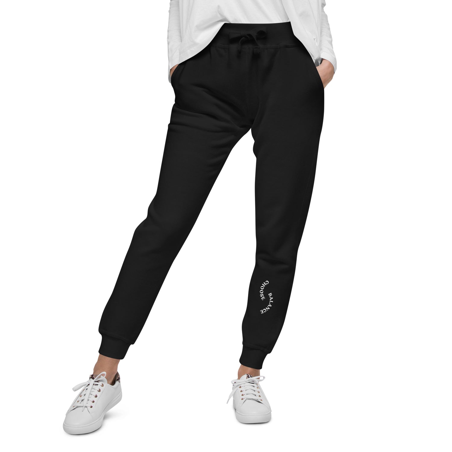 Closeup of Black Sweat pant with "Choose Balance" printed on left lower leg.