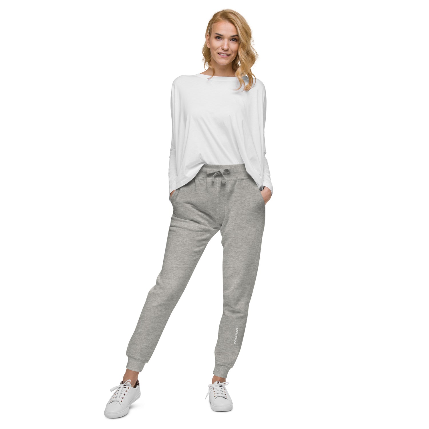 Grey sweat pant featuring " Inner peace' printed on left lower leg. 