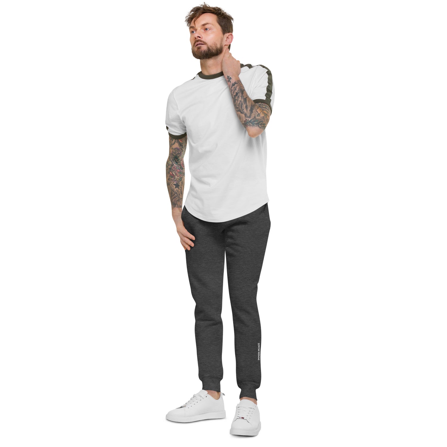 Side of Charcoal sweat pant featuring " Inner peace' printed on left lower leg.  