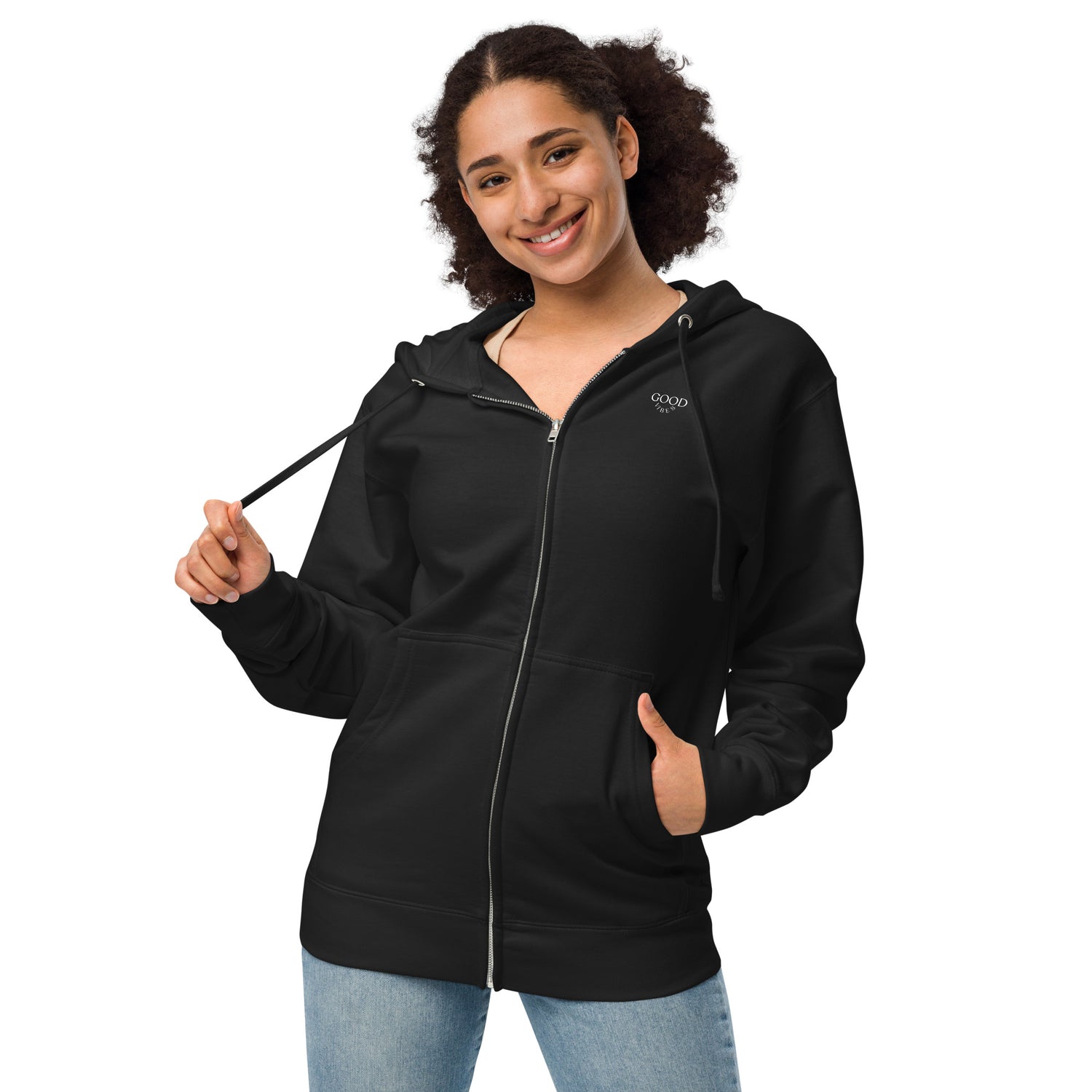 A woman wearing a Black zip up hoodie with a "Good Vibes" printed on chest.