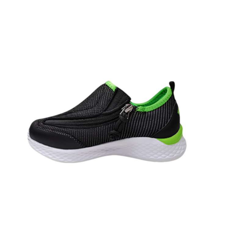 Black kids shoe with white bottom, green accents, and side zipper access.