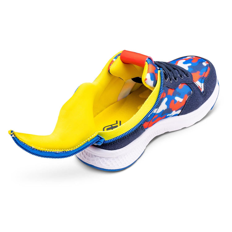 Primary color camo and navy kids shoe unzipped with rear zipper access and yellow interior padding.