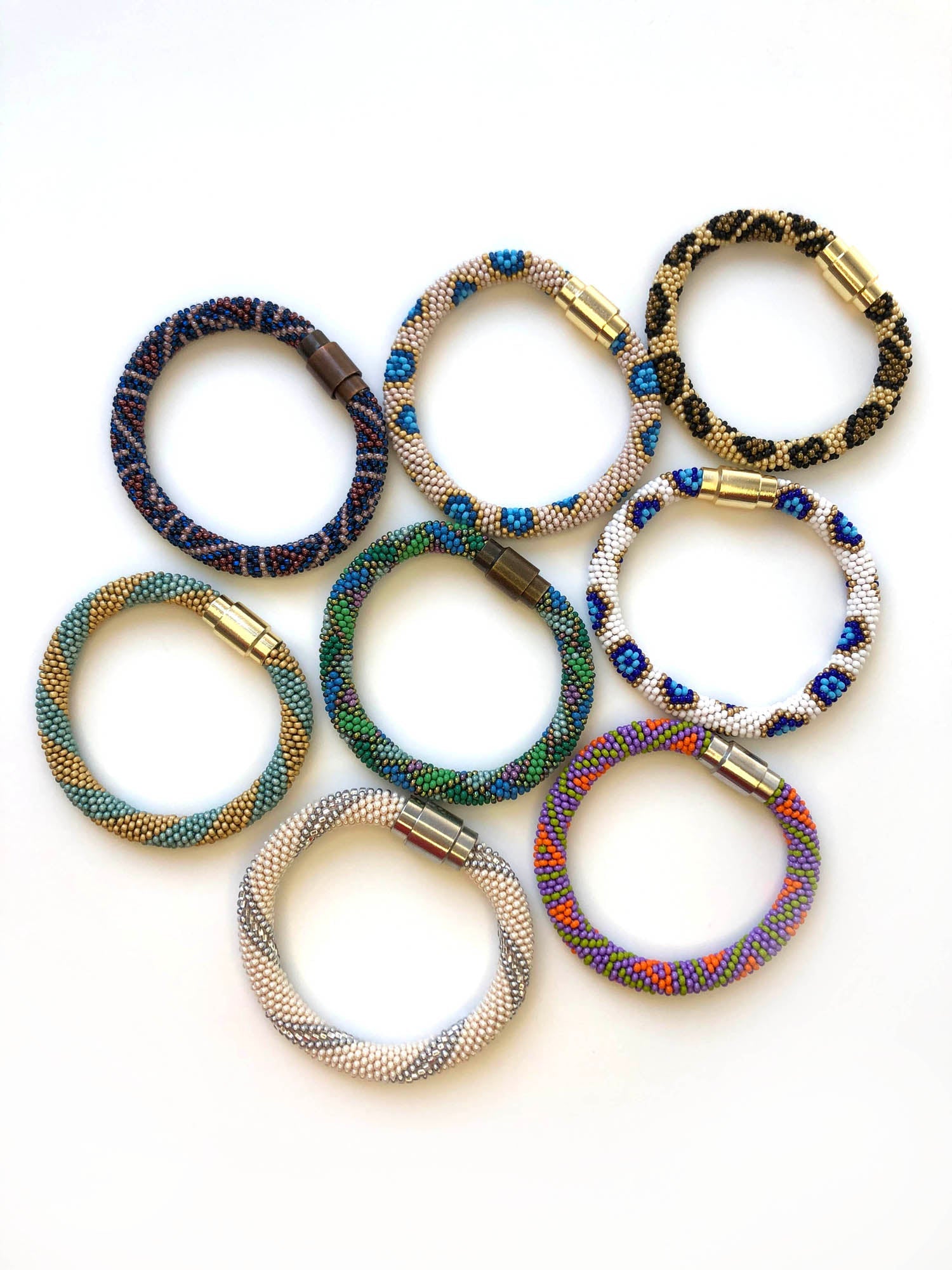 Variety of different colored bracelets with magnetic closures.