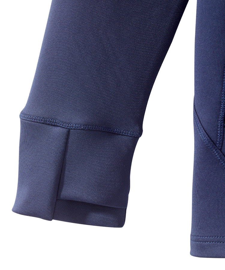 Sleeve detail of navy jacket