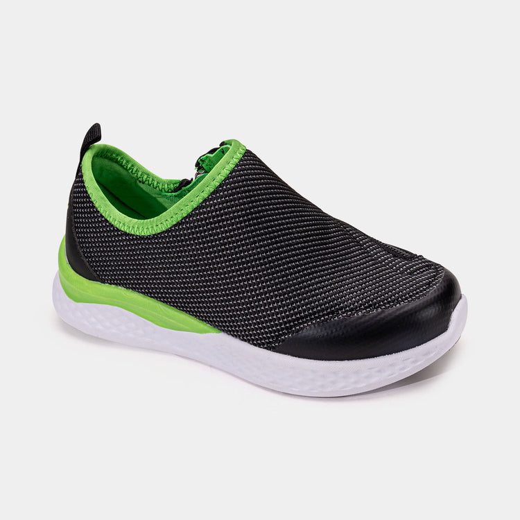 Black kids shoe with white bottom, green accents, and side zipper access.