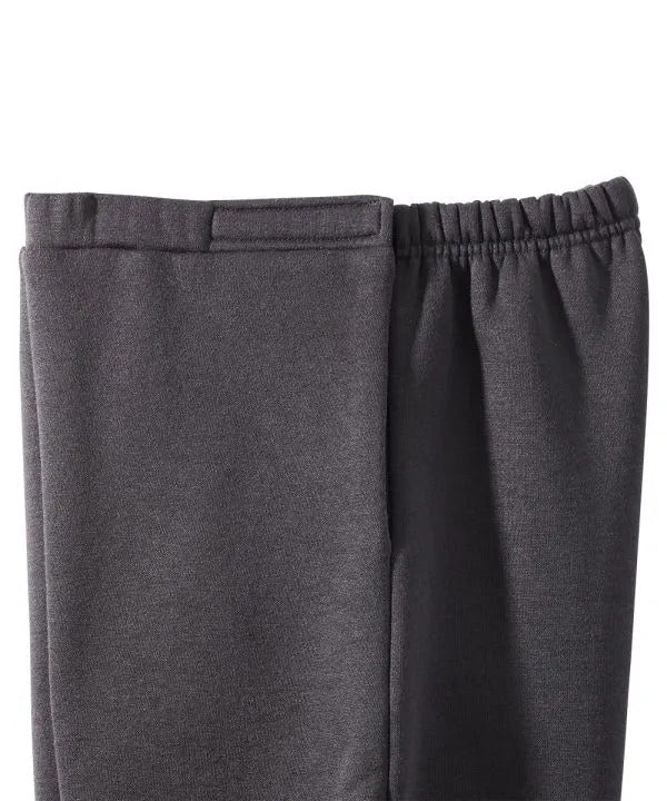 Close up of women’s black side soft knit pants with elastic waist