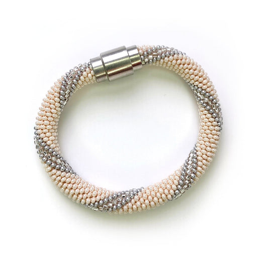 Cream and silver bracelet with silver magnetic closure.