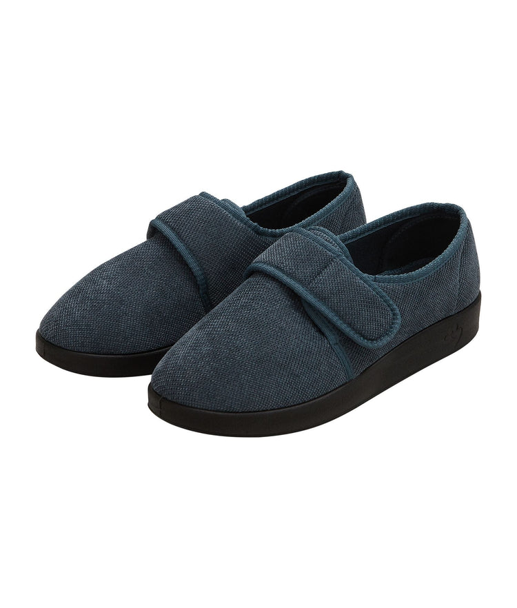 Wide soft grey indoor slippers with large Velcro closure at front and black soles