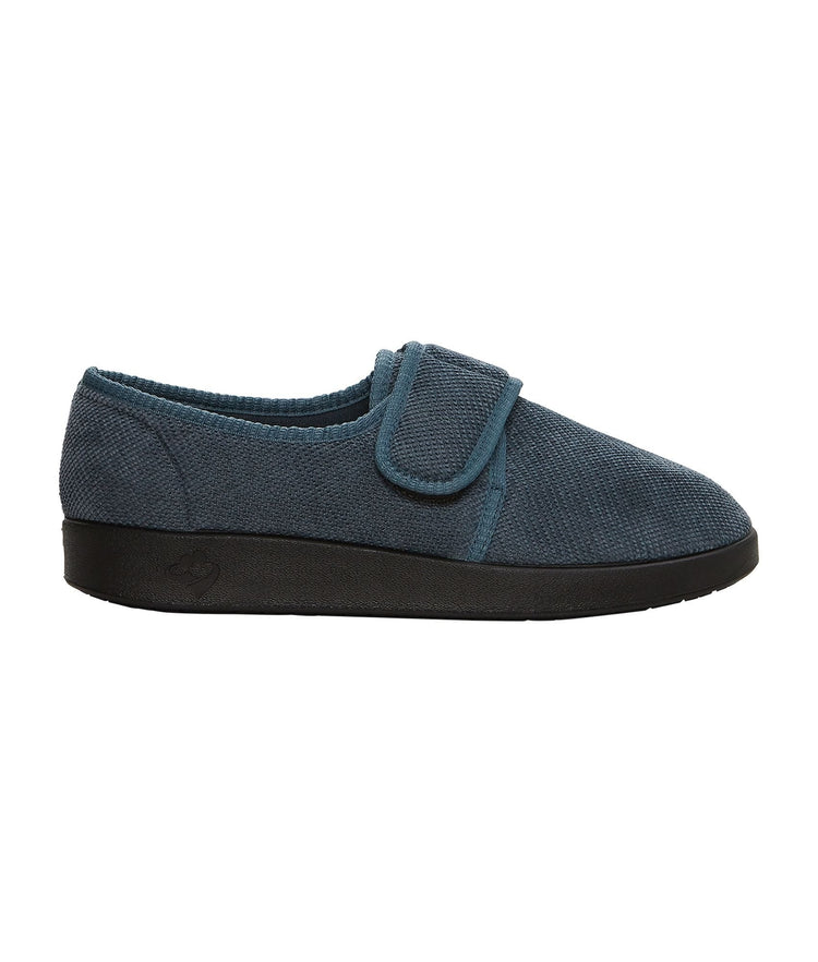 Side of wide grey non-slip indoor slippers with large Velcro closure at top adjusting fit
