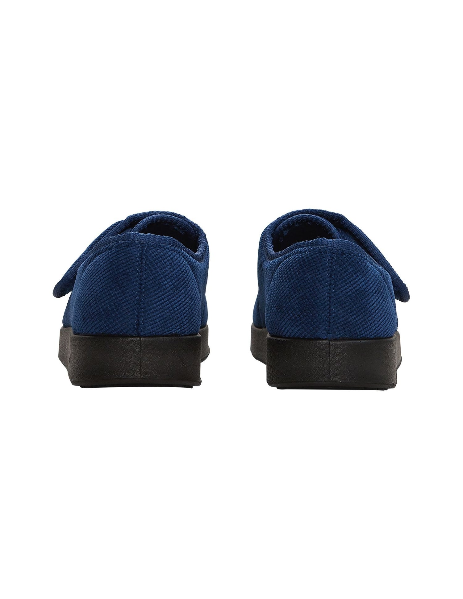 Back of soft and flexible wide navy indoor slippers with non slip black soles