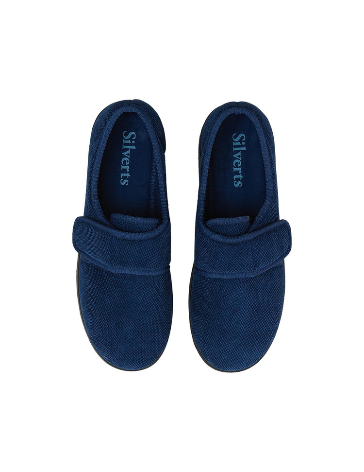 Top of wide navy indoor slippers with Velcro closures and removable memory foam insoles