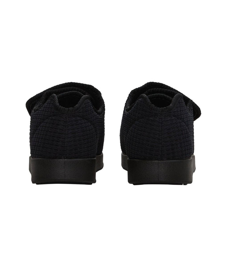 Back of extra wide black indoor slippers with ankle cushion and removable memory foam insoles