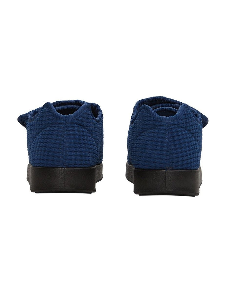 Back of extra wide navy indoor slippers with ankle cushion and removable memory foam insoles