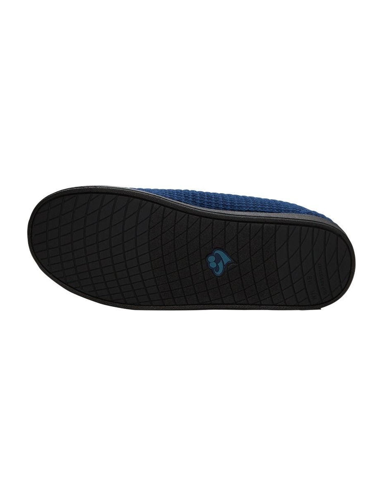 Bottom of wide navy indoor slippers with black soles and removable memory foam insoles