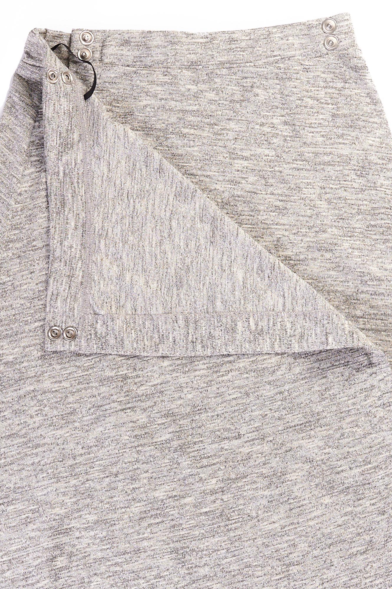Close up of the waist of grey wrap skirt with snap closure waist band.