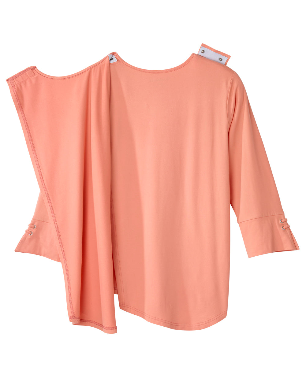 Back of peach flowy top with open back and snap closures on shoulders