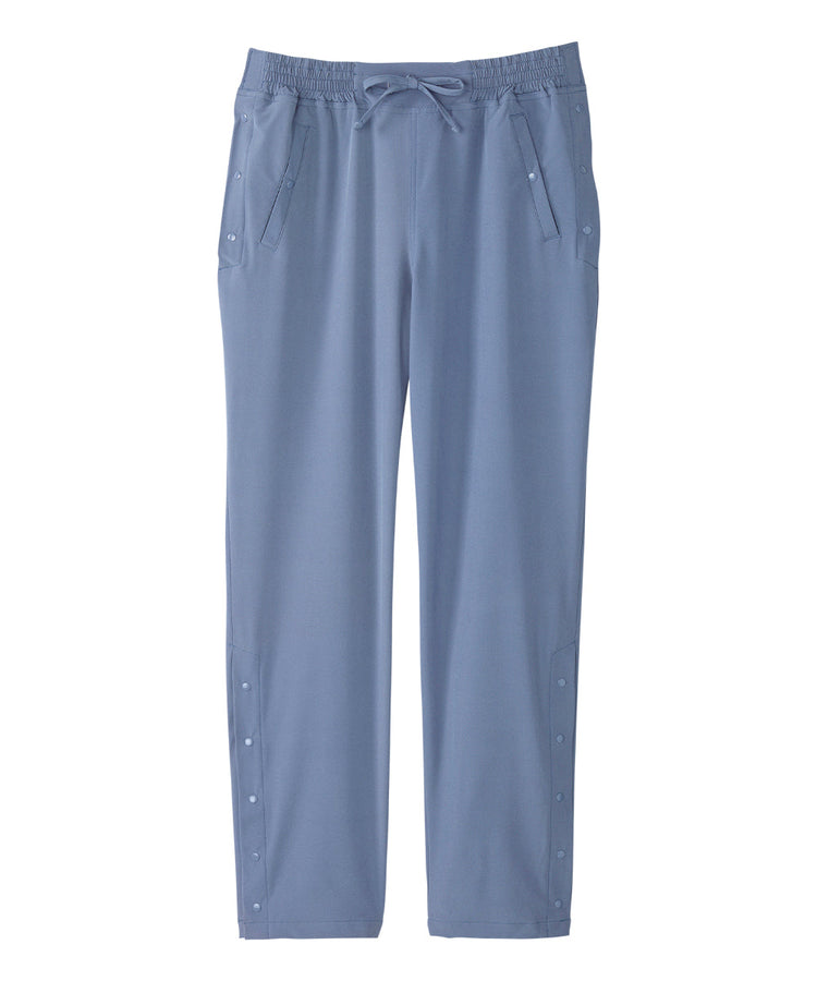 Women’s light blue leisure pants with snaps along the waist and leg openings.