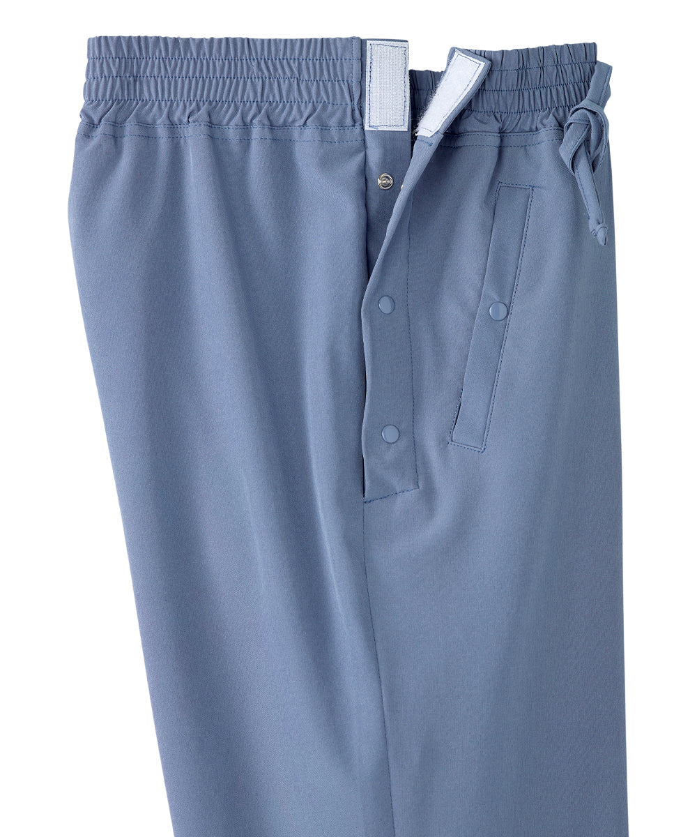 Close up of waist of women’s light blue leisure pants with snaps and elastic waistband.