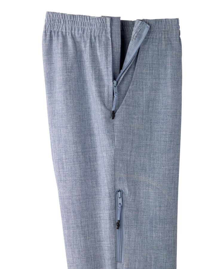 Close up of women’s light blue linen pants with zipper and velcro on side seams.