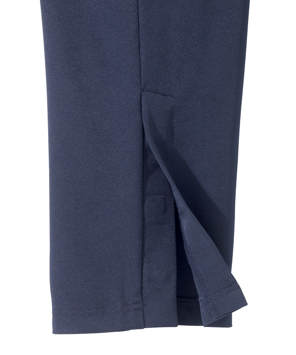 Bottom of women’s indigo blue zipper pants with vent on bottom of pants.