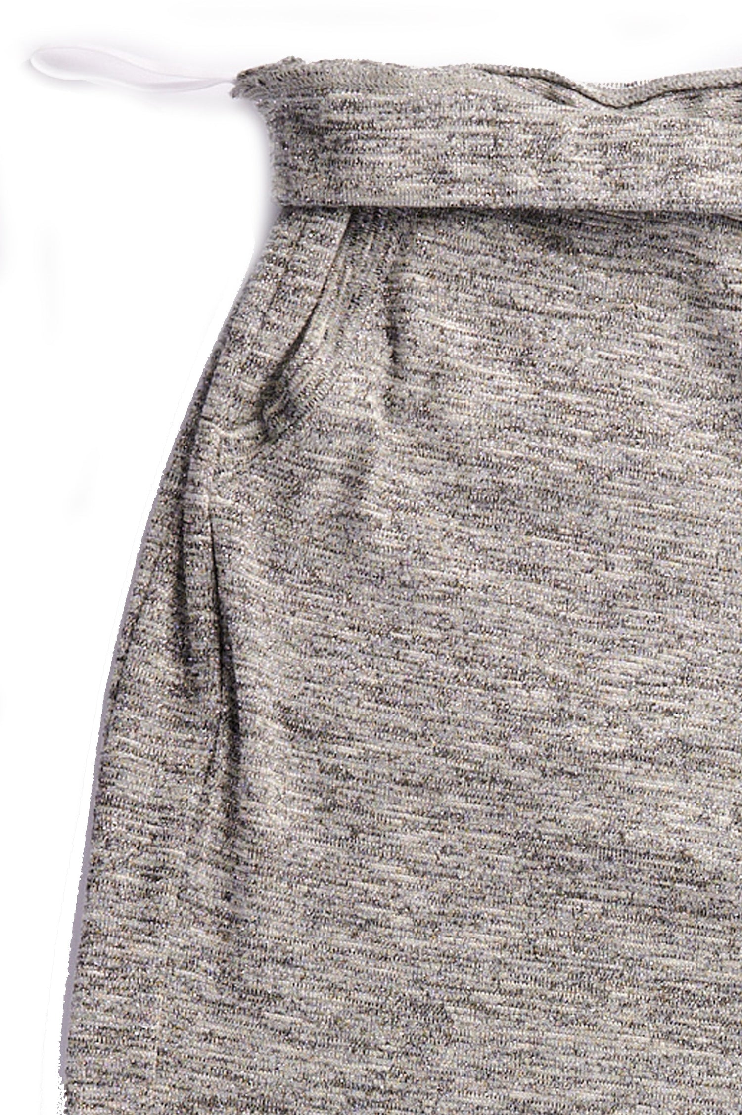 Close up view of the waist of grey full length slim pants with ankle snap closures.