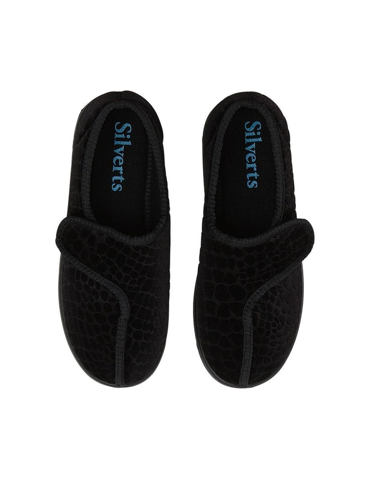 Top of black slippers with Velcro closures for adjustable fit and removable memory foam insoles